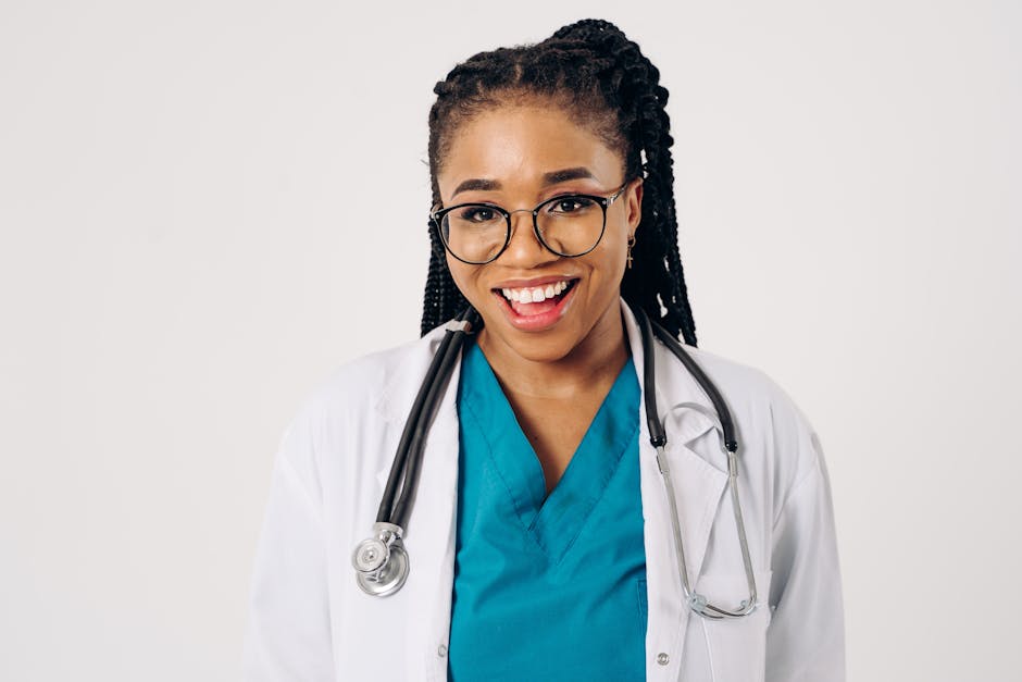 Portrait of a smiling female doctor in a lab coat and stethoscope, exuding confidence.